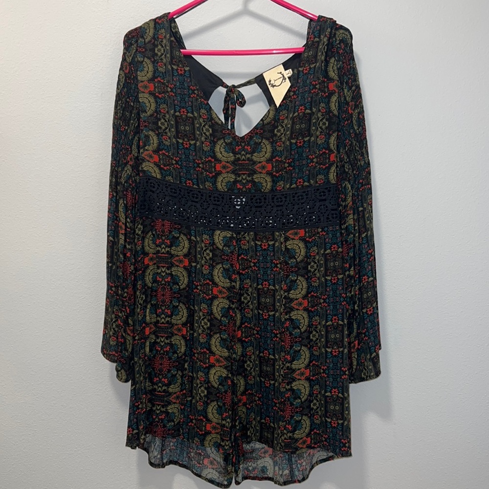 Romper with bell sleeves.